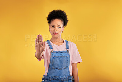Buy stock photo Stop, hand and warning with portrait of black woman in studio for emoji, no and voice. Rejection, opinion and sign with person on yellow background for protest, discrimination and forbidden icon