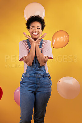 Buy stock photo Balloons, wow and happy woman on birthday, prize or giveaway success, winning and celebration. Party, excited and young african person or gen z winner, competition or sale on yellow studio background