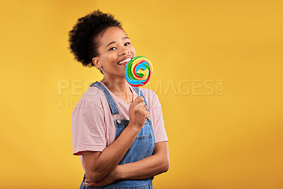 Buy stock photo Happy, candy and portrait of a black woman with a lollipop on a studio background for food. Smile, mockup and an African girl or model with sweets for dessert isolated on a backdrop with space