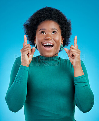 Buy stock photo Hands, pointing up and black woman with wow news in studio for promo, announcement or deal on blue background. Omg, surprise and African female model show sale, coming soon or how to sign up steps