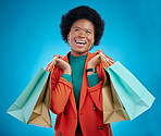 Shopping bag, thinking portrait and woman for fashion discount, giveaway wow or retail sales on blue background. Happy, excited and clothes inspiration of customer, winner or african person in studio