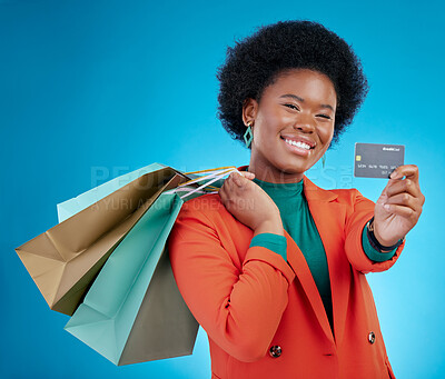 Buy stock photo Credit card, shopping offer and woman in portrait for retail banking, finance and e commerce fintech or payment. Customer face, fashion model or african person, bag and debt on blue studio background
