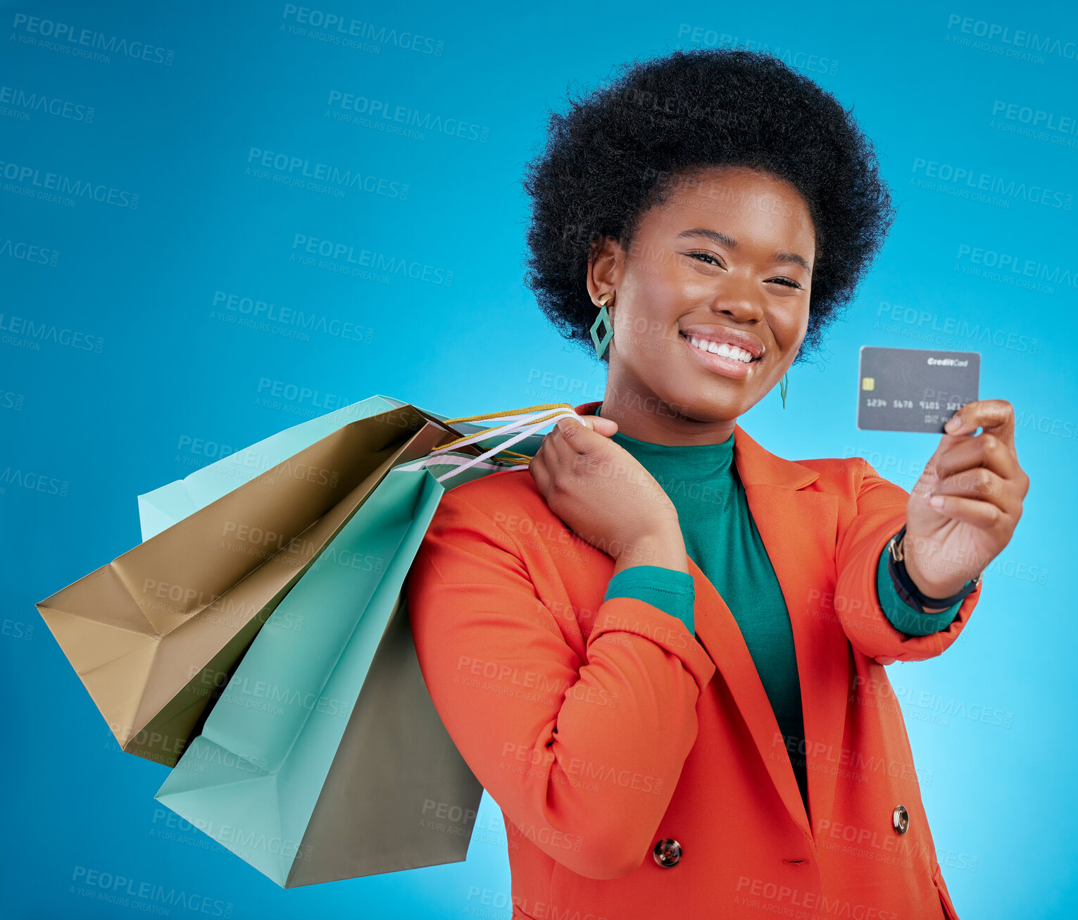 Buy stock photo Credit card, shopping offer and woman in portrait for retail banking, finance and e commerce fintech or payment. Customer face, fashion model or african person, bag and debt on blue studio background