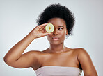 Black woman, apple and afro for diet, natural nutrition or health against a white studio background. Face of African female person or model with organic fruit for fiber, vitamins or skincare wellness