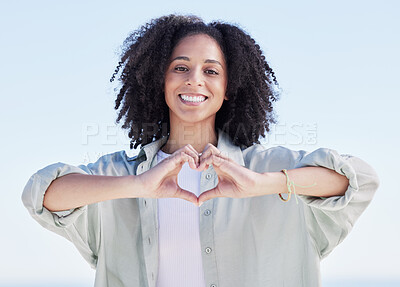 Buy stock photo Woman, heart hands and portrait on beach, happiness and support with emoji, travel and wellness with health outdoor. Adventure, love sign and female person with smile, peace and calm with care