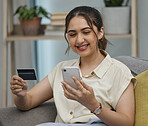 Happy woman, credit card and online shopping on smartphone in home for digital payment, fintech or money transfer. Female, mobile banking and finance of cash, web sales and password for financial app