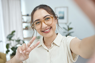 Buy stock photo Woman, smile in selfie with peace hand sign, emoji and social media influencer with post or live streaming. Young female person, gen z and happy posing in picture, memory and content creation