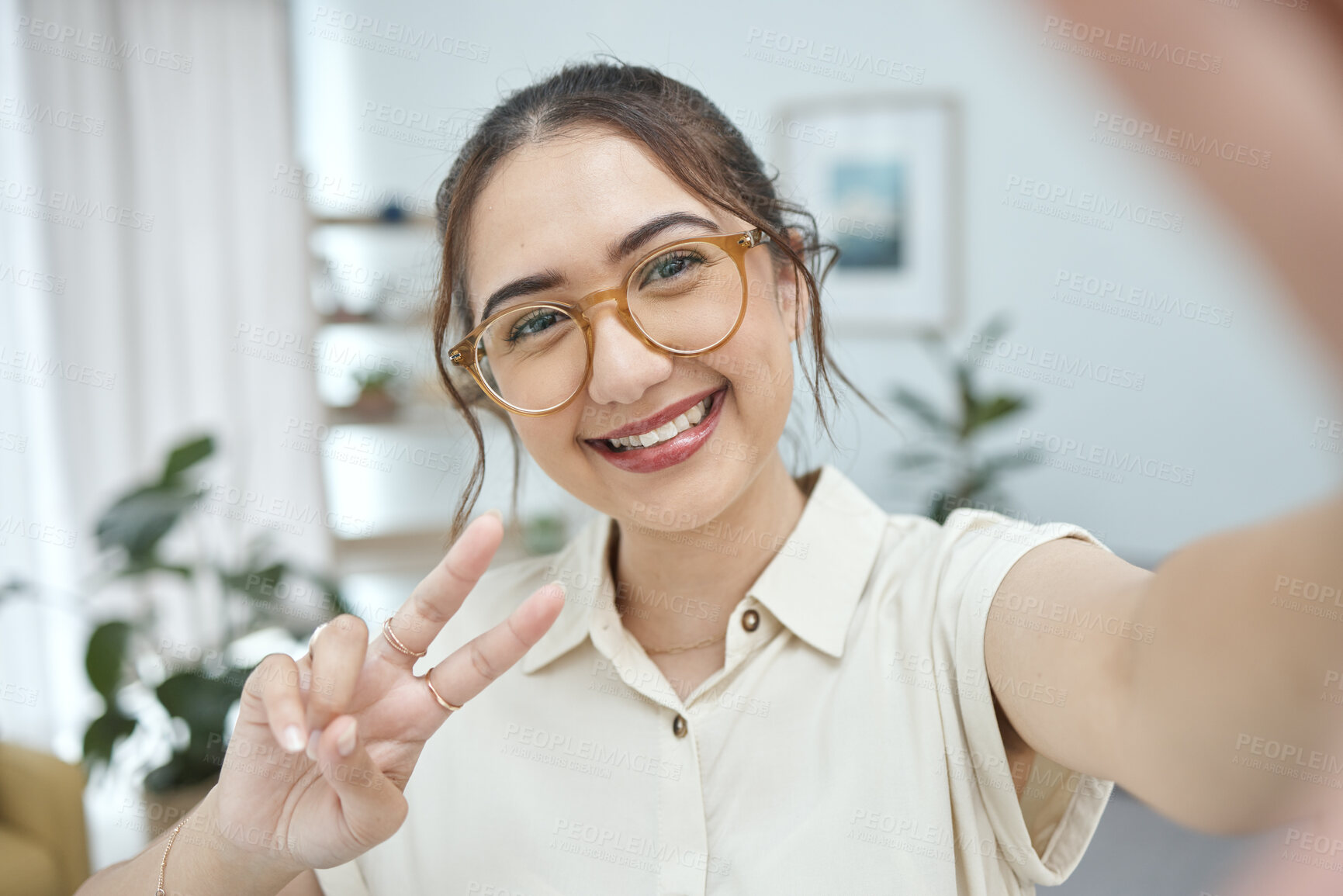 Buy stock photo Woman, smile in selfie with peace hand sign, emoji and social media influencer with post or live streaming. Young female person, gen z and happy posing in picture, memory and content creation