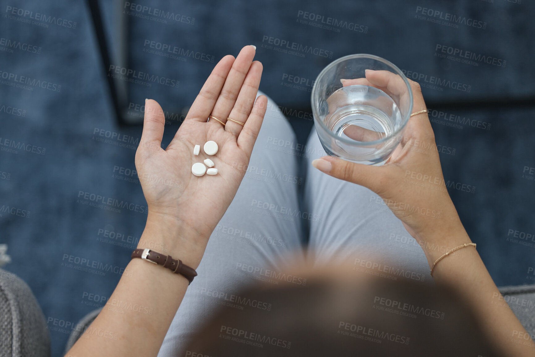 Buy stock photo Hands, pills and water in glass with health, sick person and pharmaceutical iron supplement for medical problem. Healthcare, top and pharmacy drugs in palm, pain relief  and prescription medicine