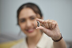 Hearing aid, hands and person with disability for medical support, listening and healthcare innovation. Closeup of deaf female patient with audiology implant to help sound waves, amplifier and volume