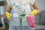 Woman, hands and detergent basket for cleaning, housekeeping or disinfection of dirt at home. Closeup of female cleaner holding container of chemical bottles, products or liquid tools of maid service