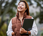 Smile, thinking and a woman with a tablet in nature for communication and entrepreneurship vision. Happy, relax and a young Asian girl or entrepreneur with technology in a park for freelance ideas