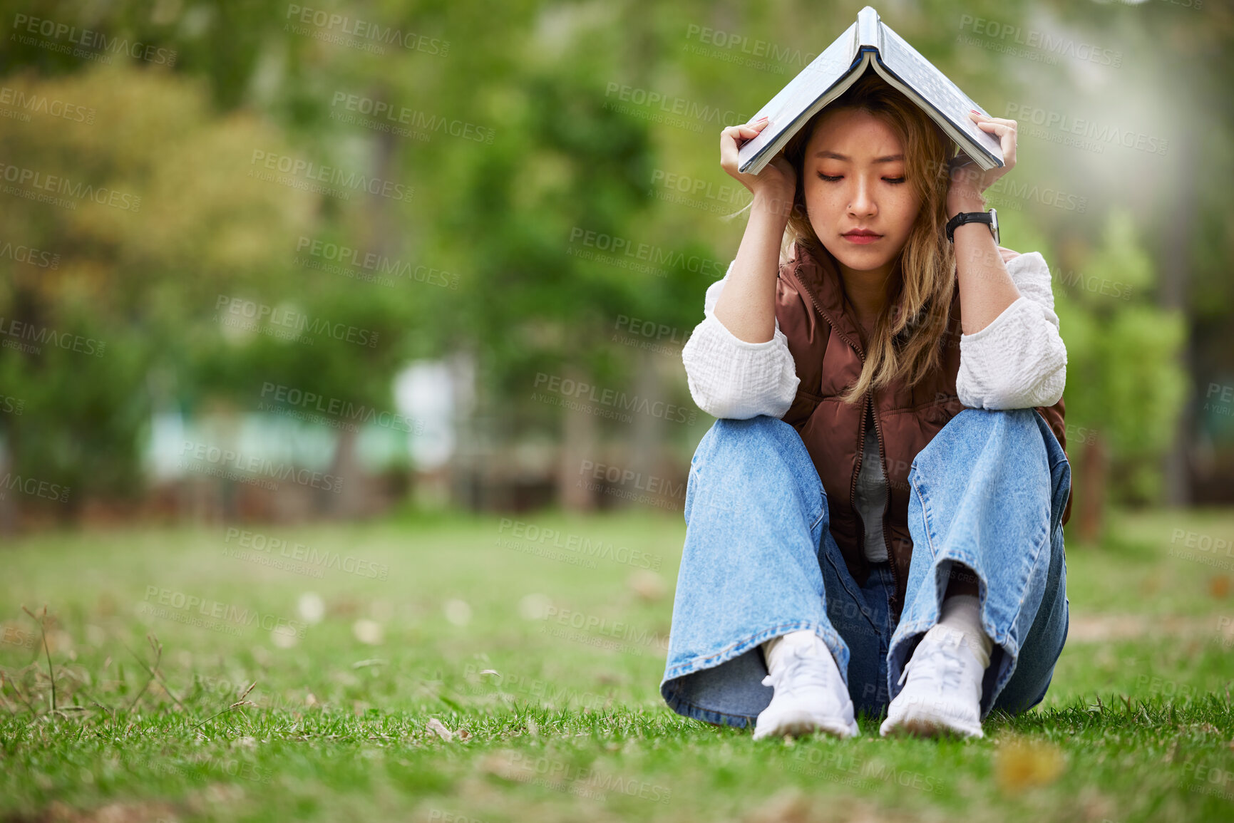 Buy stock photo Study, sad and book with woman in park for studying, thinking or depression mockup. College, mental health and education with asian student on grass in nature for burnout, anxiety and fatigue problem