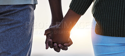 Buy stock photo Holding hands, couple and love outdoor at the beach with care, trust and commitment. Closeup of a man and woman relax together on vacation, holiday or sunset travel adventure in nature for freedom