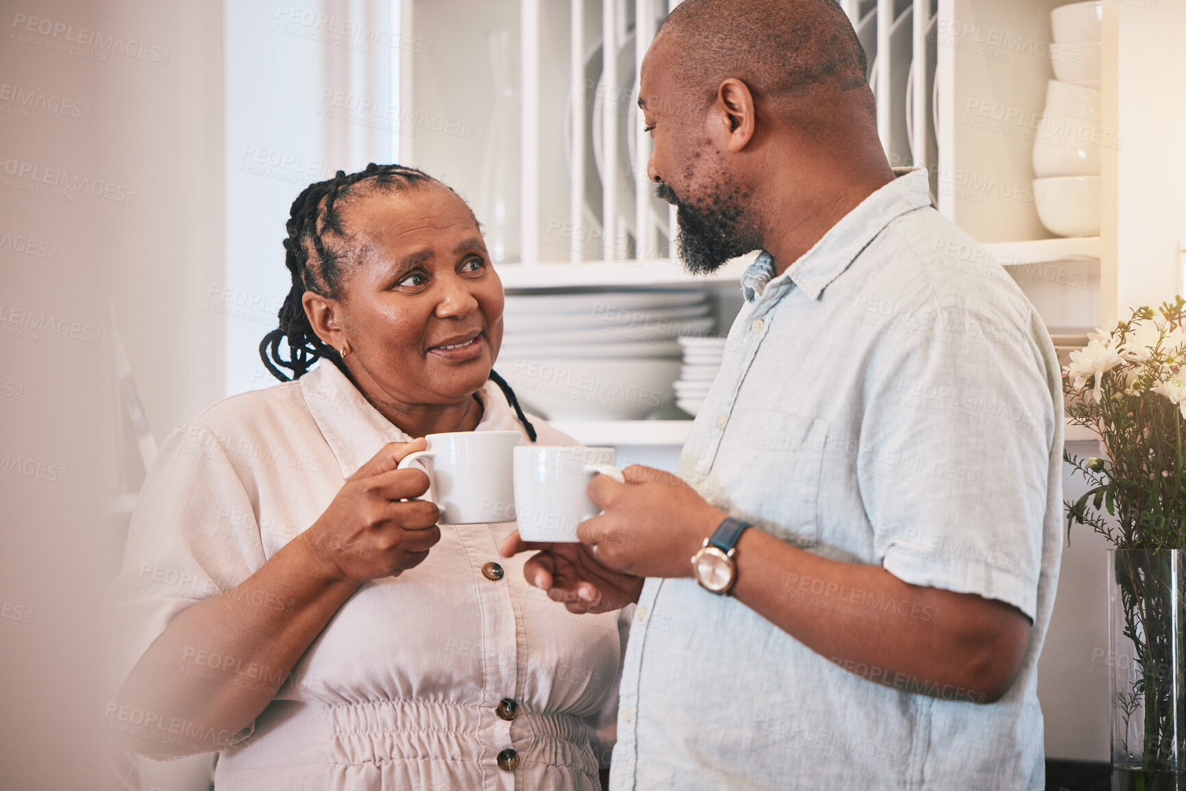 Buy stock photo Love, coffee and morning with black couple in kitchen for happy, relax and peace. Conversation, happiness and date with man and woman drinking tea at home for care, health and marriage together