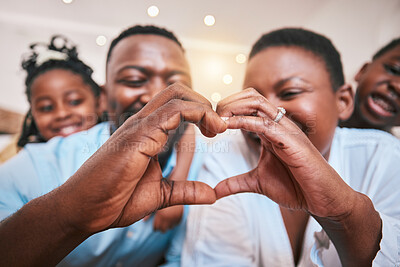 Buy stock photo Hands in heart, family and parent with children in home with gesture for love, support and care. Emoji, happy kids and closeup of African mom and dad with shape for bonding and healthy relationship