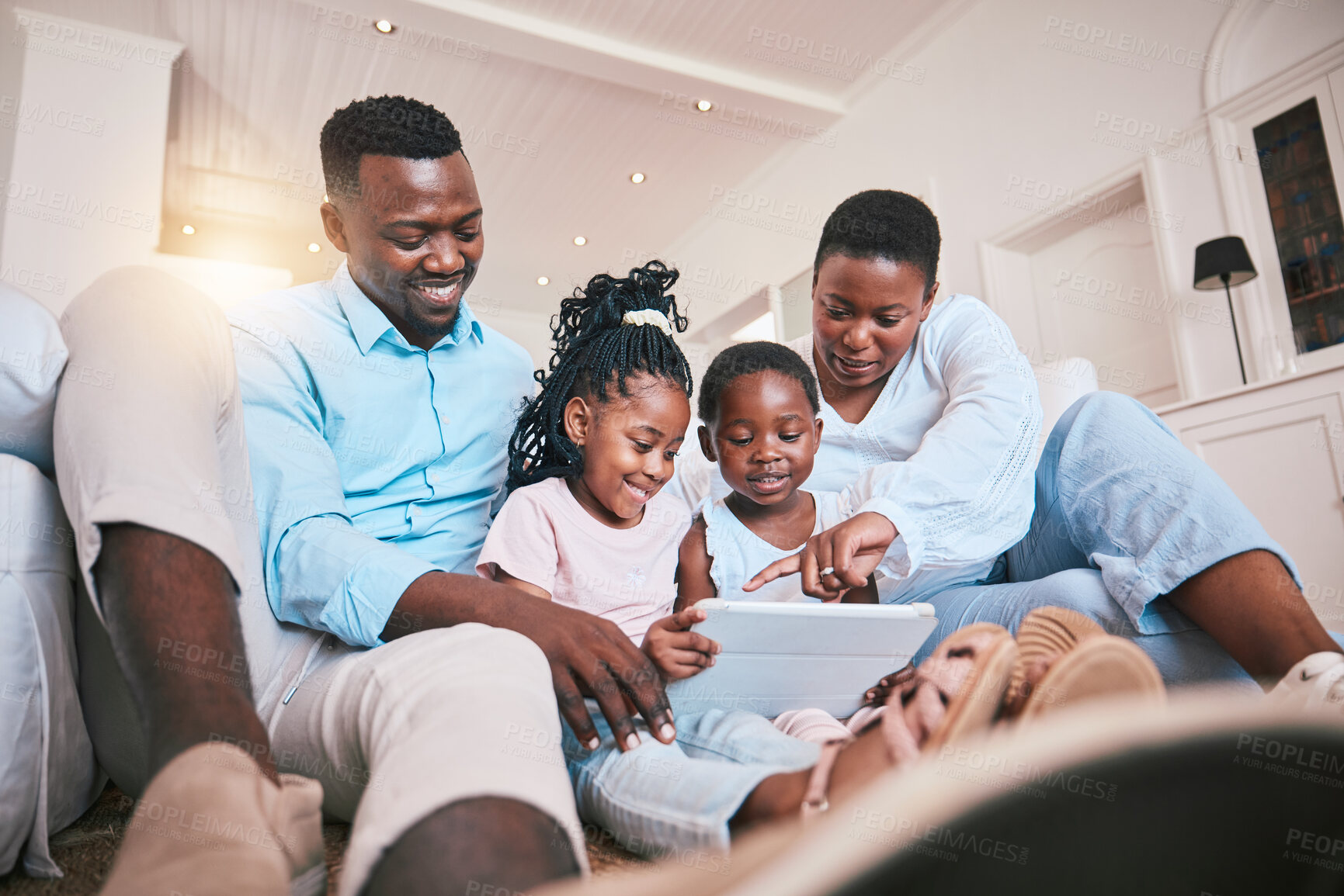 Buy stock photo Relax, streaming and tablet with black family in living room for happy, games and elearning app. Digital, technology and internet with parents and children at home for movies, education and network