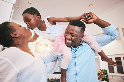 Buy stock photo Family, kiss or piggyback and a girl in the home with her parents for fun or bonding together. Mothers day, love or smile with african parents and their daughter looking playful in their house 