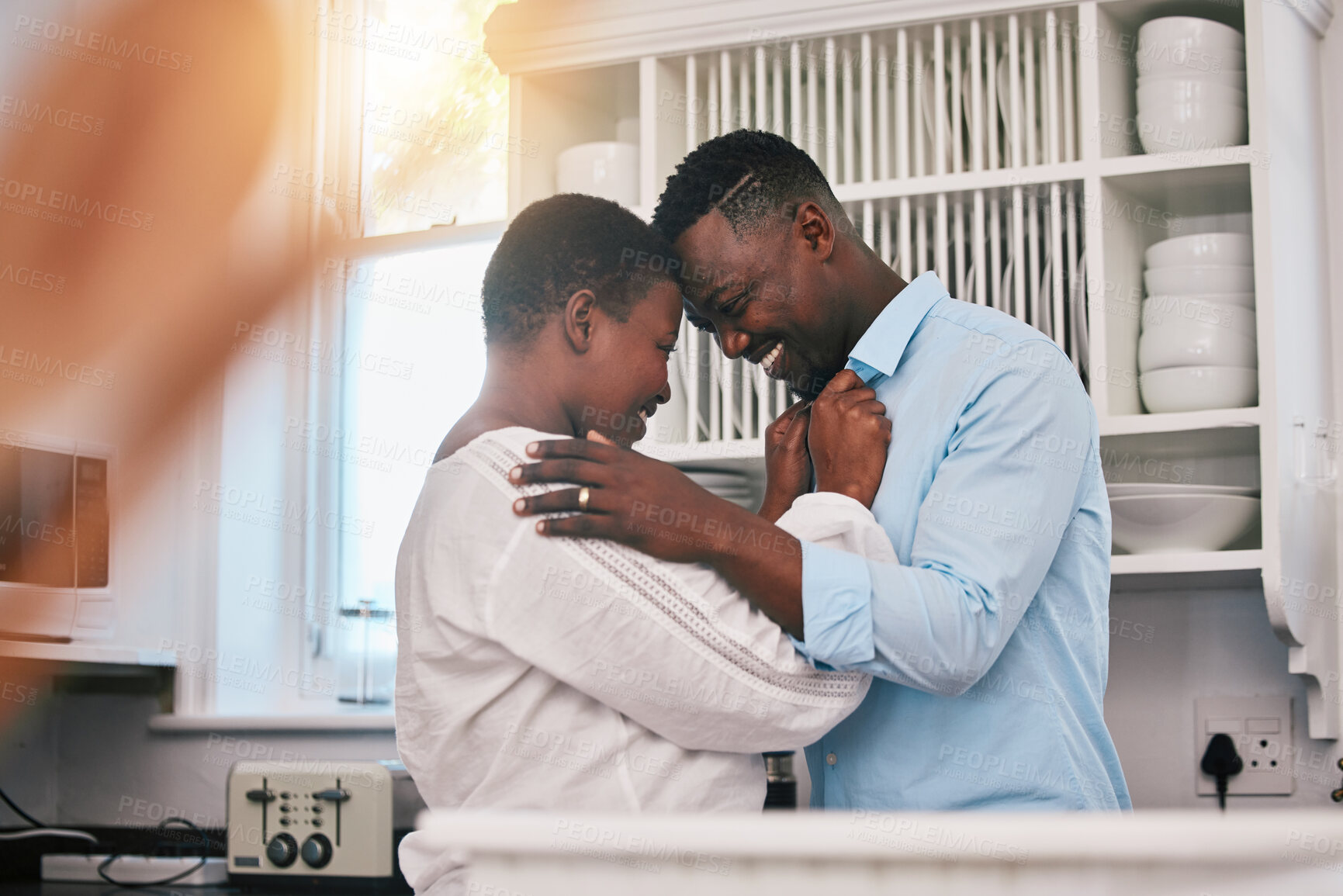 Buy stock photo Hug, happy and a mature black couple in the kitchen with care, love and quality time in the morning. Happy, together and an African man and woman with gratitude or kindness in a house for romance