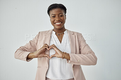 Buy stock photo Happy black woman, portrait and heart hands for love, care or compassion against a white studio background. African female person with loving emoji, symbol and sign or hand gesture on mockup space