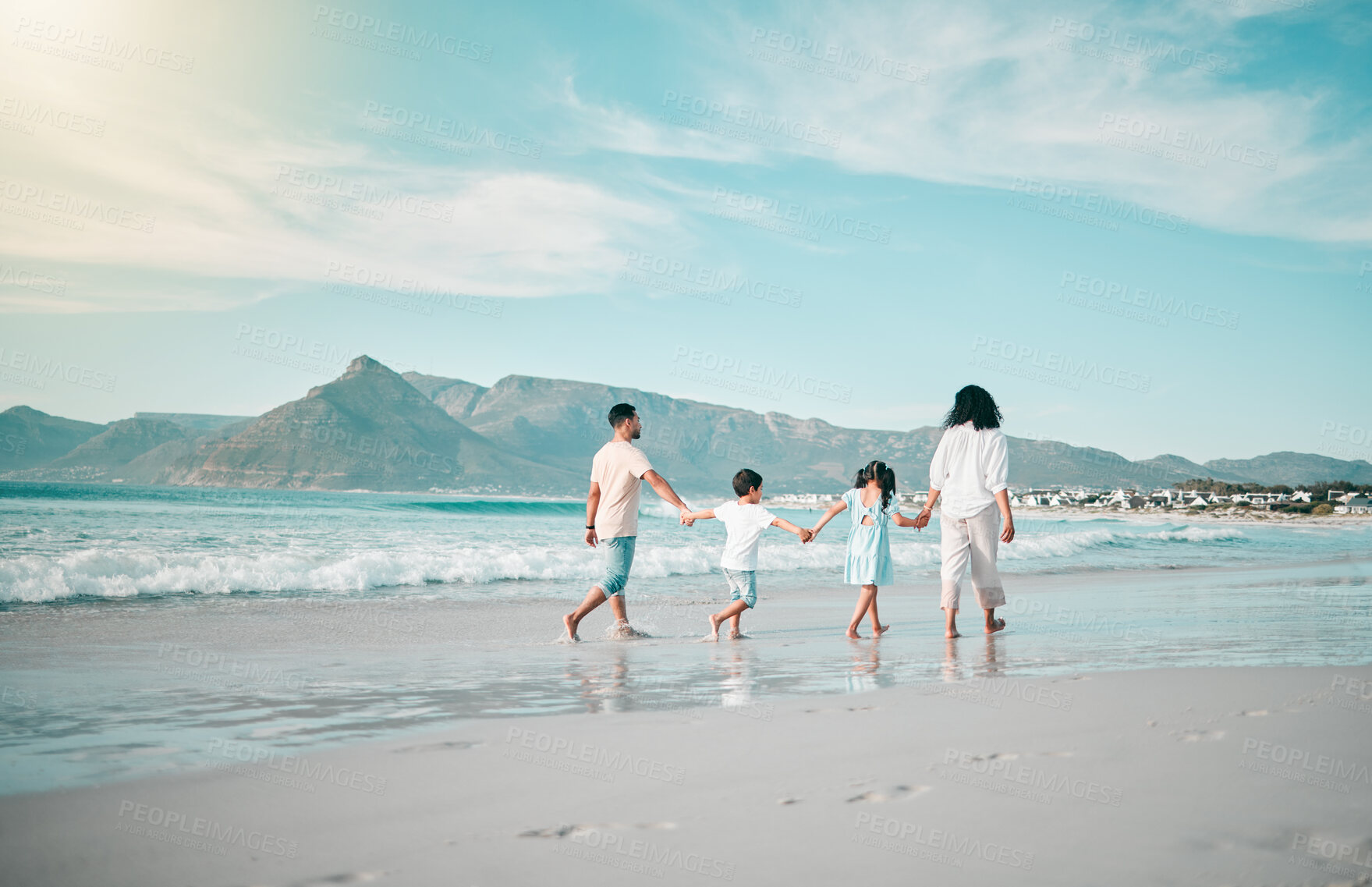 Buy stock photo Holding hands, walking and family and the beach from behind with freedom, vacation and fun at sea. Ocean and children with parents in Hawaii for travel, bond and summer holiday on sky mockup space