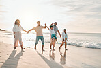 Holding hands, big family and swing at the beach walking with freedom, travel and bonding at sunset. Love, lifting and and boy child with grandparents and parents at sea on walk for summer holiday