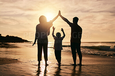 Buy stock photo Silhouette, family and protection, beach at sunset with parents and child, safety and ocean waves. Bonding in nature, insurance and people outdoor, tropical holiday and travel with trust and love