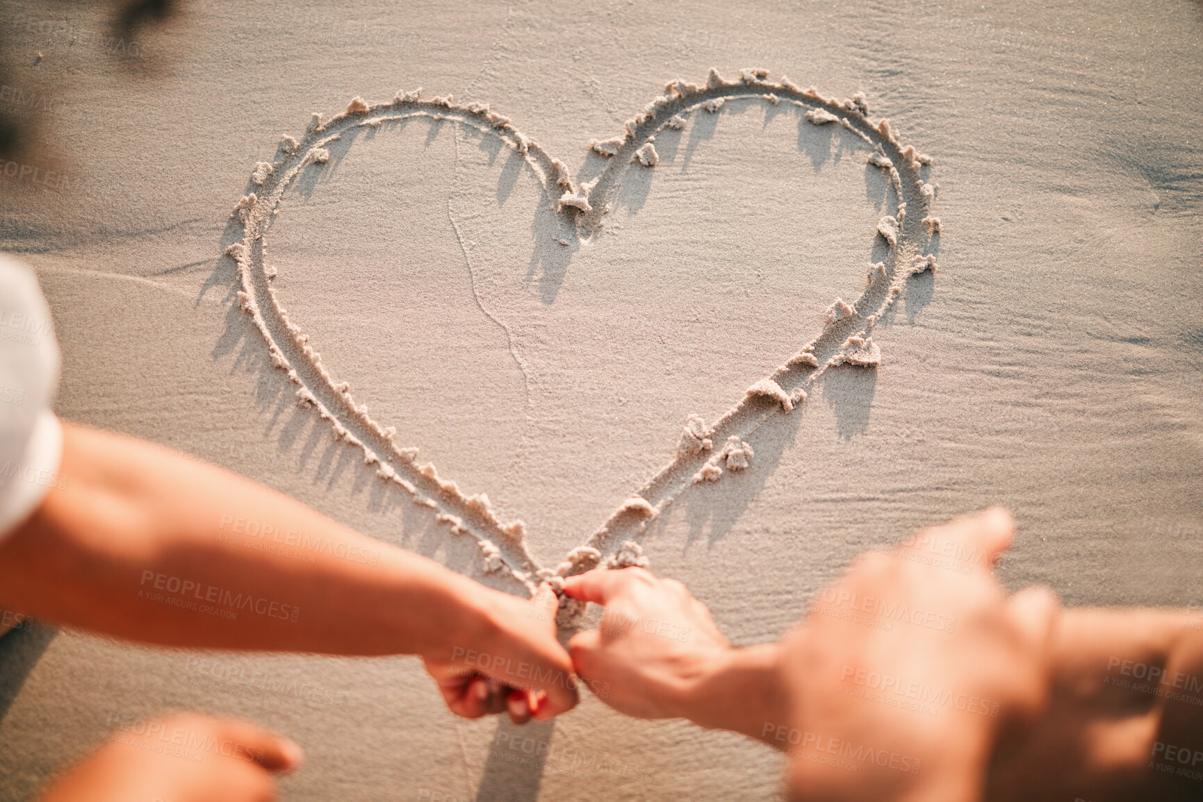 Buy stock photo Hands, drawing and heart on beach sand for care and couple with kindness or support together with emoji. Draw, love or writing symbol in the shape of loving, caring or line in the for romance