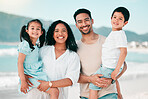 Family in portrait on beach, parents and children with bonding on holiday, happy people and smile with travel. Mother, father and young kids, tropical vacation in Mexico with love and care outdoor