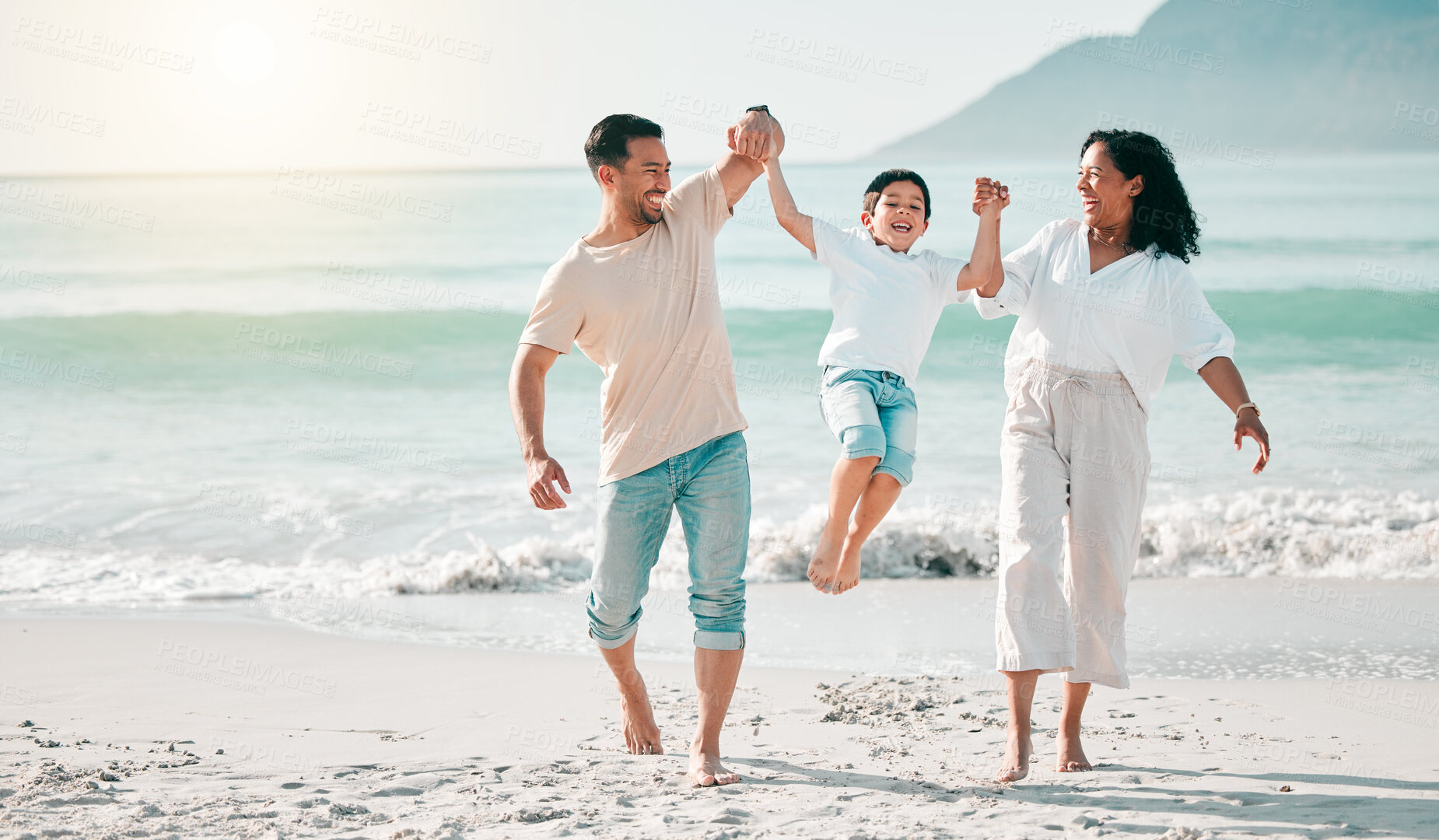 Buy stock photo Holding hands, dad or mother playing child at beach with a happy family for holiday vacation travel in nature. Jump, parents or mom lifting child with dad walking at sea or ocean bonding together