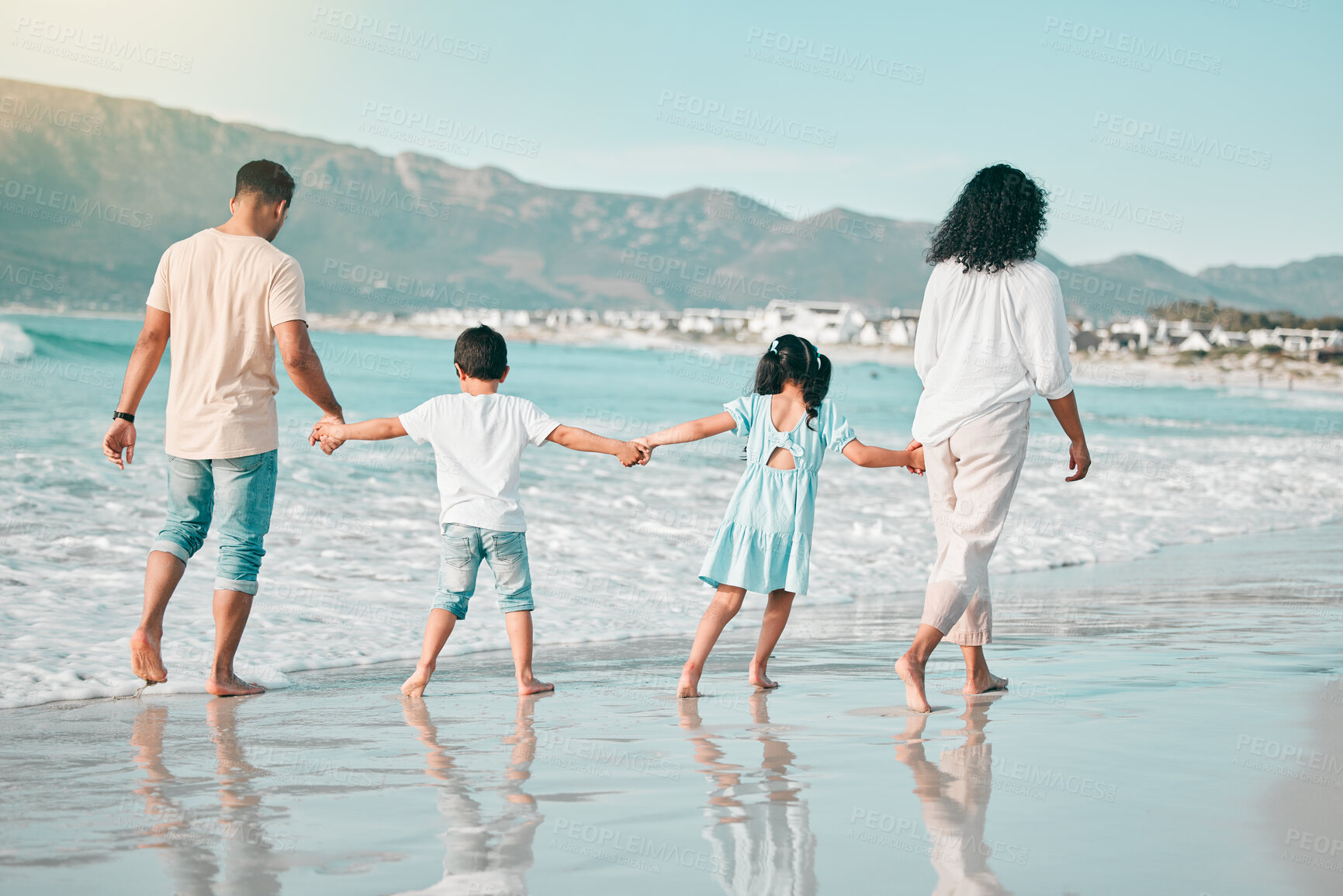 Buy stock photo Hand holding, family is walking on beach and back view with ocean waves, summer and bonding in nature. Parents, children and people outdoor on holiday, freedom and travel, trust and love in Mexico