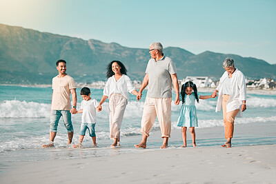 Buy stock photo Generations, holding hands and walking family on beach and ocean waves, freedom and bonding in nature. Grandparents, parents and kids, people outdoor and travel with trust and love on Mexican holiday