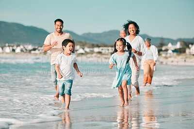 Buy stock photo Family running on the beach, ocean and energy with bonding on holiday, happiness and freedom with travel. Parents, young children and carefree with tropical vacation in Mexico, love and care outdoor