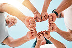 Fist bump, hands and business people with support on sky background for teamwork, solidarity or low angle commitment. V, sign and team power sign in collaboration, partnership or goal motivation