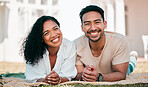 Portrait, smile and couple on picnic blanket outdoor, bonding and relax together in backyard garden at home. Face, interracial and Asian man and woman with love, happy and quality time on grass lawn