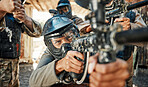 Paintball game, gun and man aim, shooting focus and target soldier, warrior or training for battlefield fight conflict. Army mission, military teamwork and team point weapon in war, action or battle