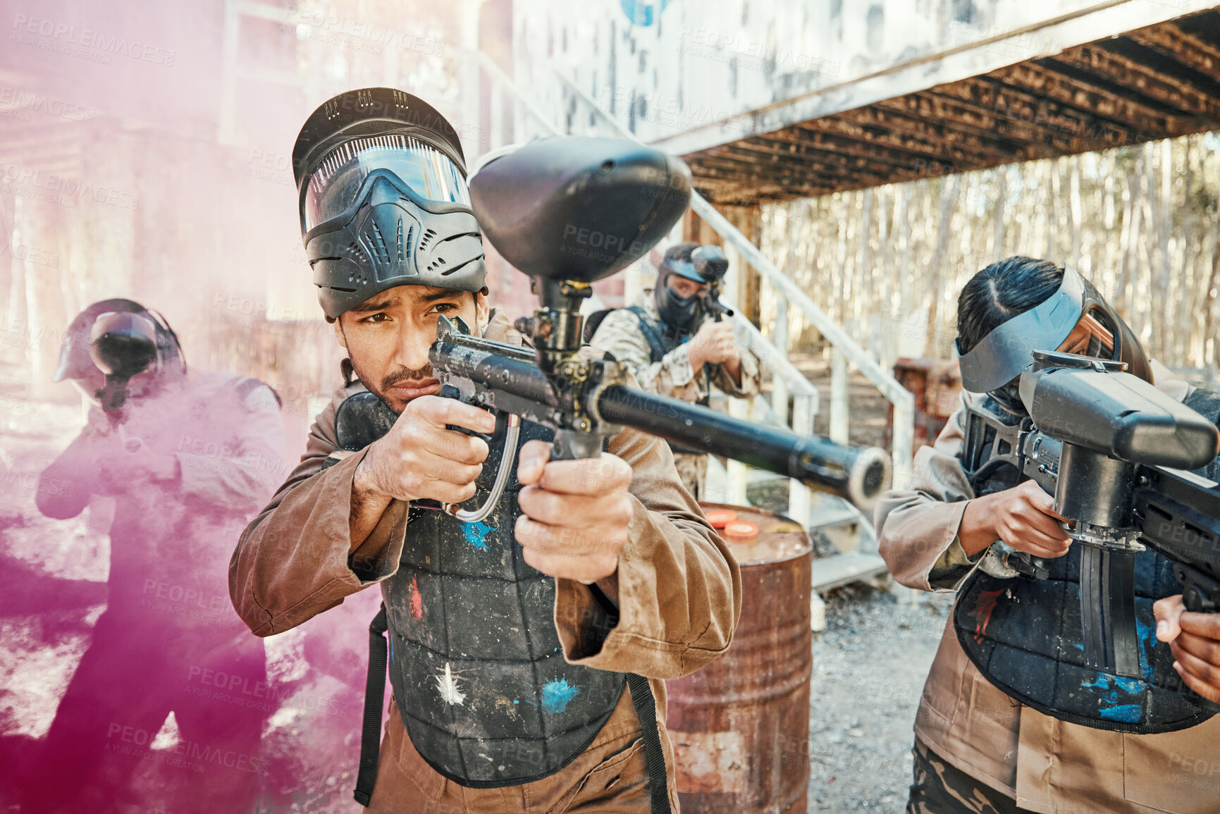 Buy stock photo Teamwork, shooting and paintball with man in game for playground, war and gaming. Challenge, mission and soldier with people and smoke in battlefield arena for target, gun and warrior training