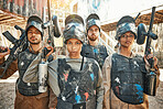 Paintball, celebrate and portrait of team or people ready for a battle and teamwork or collaboration together. Concentrate, sports and army on a mission on the battlefield with guns for competition