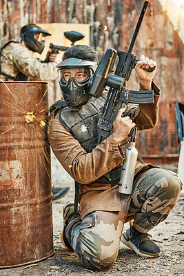 Buy stock photo Paintball, soldier and man with gun for tournament, competition and battle in arena. Extreme sports, military and male person shooting in outdoor gear for training, adventure games and challenge