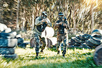 Teamwork, fast and paintball with man in game for playground, motion blur and gaming. Challenge, mission and soldier with people shooting in battlefield arena for target, gun and warrior training