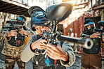 Paintball team, gun and woman focus on player challenge, target aim or military conflict, fight or soldier mission. Group, serious or people pointing weapon in survival war, action or battle training