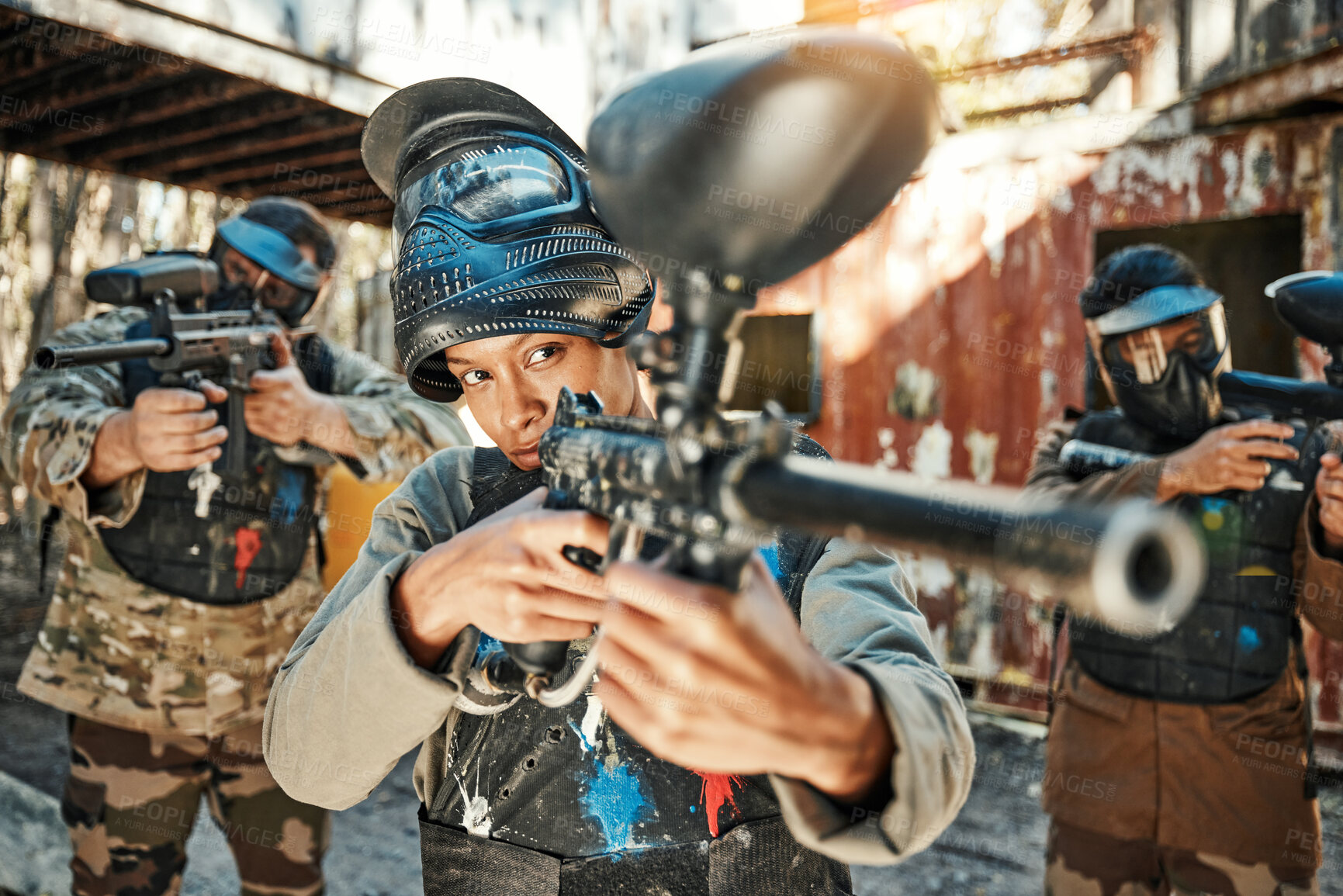 Buy stock photo Paintball team, gun and woman focus on player challenge, target aim or military conflict, fight or soldier mission. Group, serious or people pointing weapon in survival war, action or battle training