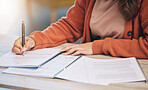 Woman, hands and writing on documents for signing contract, form or application on desk at home. Closeup of female person working on paperwork, notes or filling in survey for legal agreement or deal