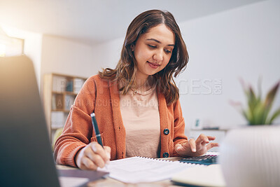 Buy stock photo Remote work from home, woman writing and laptop with finance, budget planning and startup. Female person, entrepreneur or accountant with documents, lounge or check paperwork with focus or connection