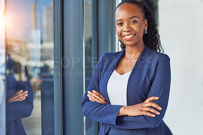 Buy stock photo Portrait, window and arms crossed with a business woman standing in her professional office. Smile, corporate leadership with a happy african manager or boss in the workplace for empowerment