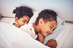 Girl, sleeping and children in bed in home with peace, comfort and rest with sisters, girls or friends together in bedroom. Kids, sleep and dream with happiness with pillow, blanket and duvet