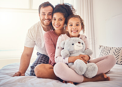 Buy stock photo Portrait, bed and family with love, happy and relax with quality time, bonding and home with care. Parents, mother and father with child, bedroom and kid with mom, dad and happiness on weekend break
