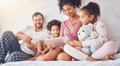 Buy stock photo Happy family, bed and tablet streaming, movies or games while bonding, relax and play in their home. Online, subscription and children with parents in a bedroom for entertainment, fun and watching