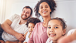 Happy family, smile and selfie on bed at home for quality time, bonding or morning. Portrait, mixed race and profile picture of a man, woman and children in a bedroom with love, care and comfort