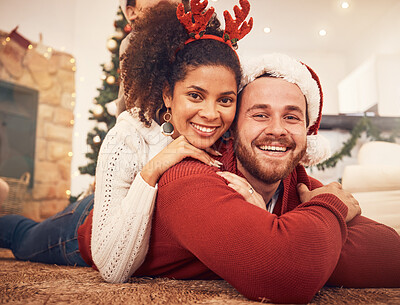 Buy stock photo Christmas, portrait and happy couple in home on floor, bonding and together. Xmas, smile and face of man with African woman, interracial and enjoying time for party, celebration and winter holiday
